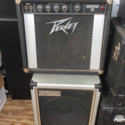 Two amplifiers comprising a Roland Cube 60 and a Peavey Backstage 30.