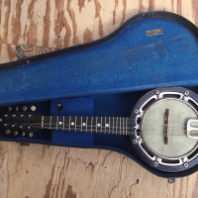 A vintage Barnes & Mullins eight string banjolele with original carry case.