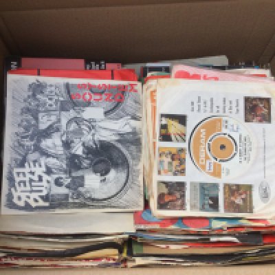 Two boxes of 7" singles and EPs by various artists including David Bowie, Kraftwerk, Steel Pulse and many more.