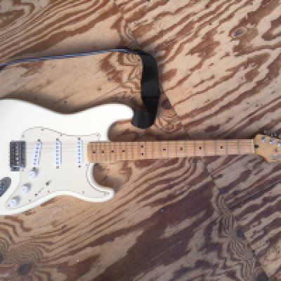 A 2005 Fender Stratocaster electric guitar, serial number MZ5203982. Comes with a soft carry case.