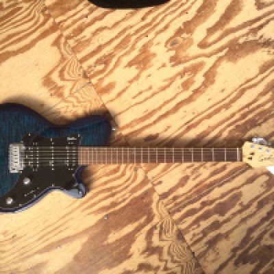A Godin SDXT electric guitar. No case.