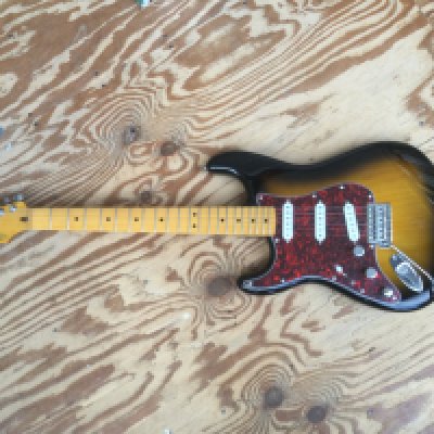 A left handed Fender Squier Stratocaster electric guitar. This is a Monterey Pop Festival reissue with upgraded Seymour Duncan pickups and Fender tuners. No case.