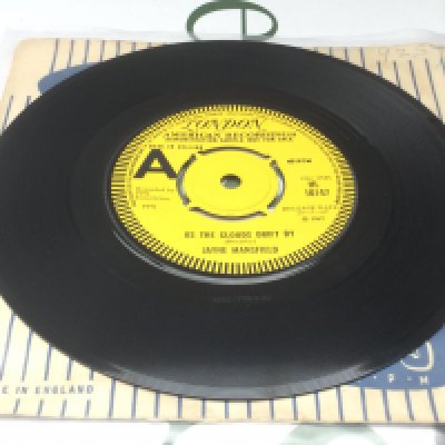 A very rare 7" demo disc by Jayne Mansfield featuring Jimi Hendrix of As The Clouds Drift By b/w Suey. Condition Ex.