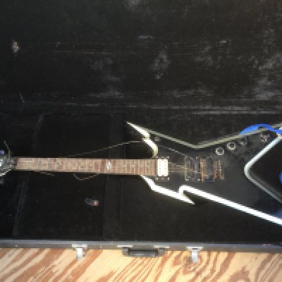 A Dean Razorback electric guitar in need of restoration with original hard carry case plus an extra Gator hard carry case (2).