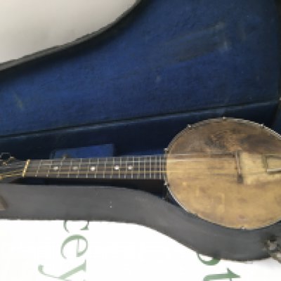 A cased open backed banjolele by J Wallis of London.