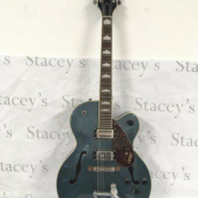 A Gretsch G2420T electric guitar with original Gretsch branded hard carry case.