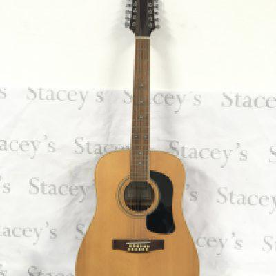 A Jim Deacon AD90 12 string acoustic guitar. Comes with a soft carry case.