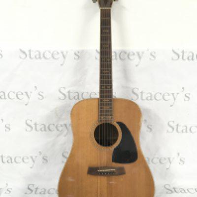 An Aria Pro II Paul Brett signature model acoustic guitar. Comes with a soft carry case.