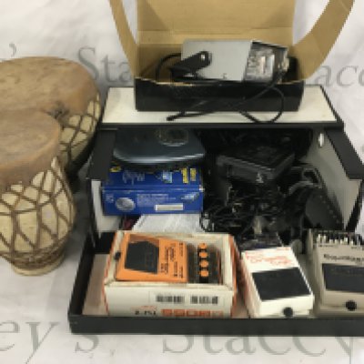 A box of miscellaneous items comprising Boss guitar pedals, a pair of bongos etc.