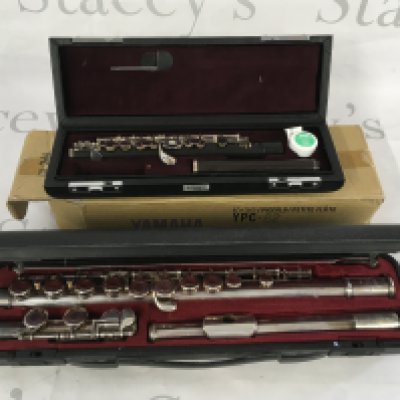 Two cased Yamaha flutes comprising a piccolo example and one other (2).