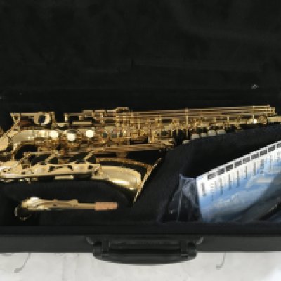 A cased Yamaha saxophone with accessories.