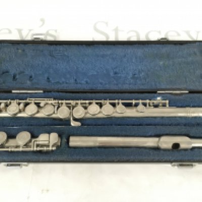 A cased Yamaha flute.