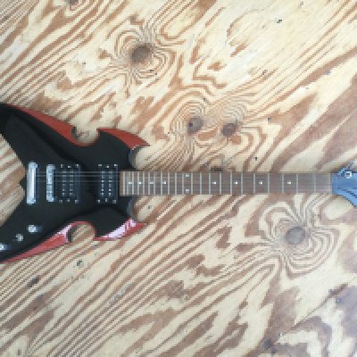 A Silvertone PS-AP1 Paul Stanley Apocalypse electric guitar. No case.