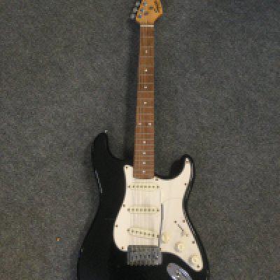 A Fender Squier Stratocaster electric guitar and a small practice amp (2).