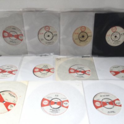 Eleven rare and collectable Island label 7" singles by various artists including Desmond Dekkar * And His Cherry Pies, The Four Aces and others.