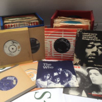 Three record cases of 7" singles by various artists including Jimi Hendrix, The Who, Rolling Stones and many more.