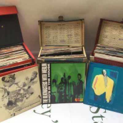Three record cases of 7" singles comprising mainly 1980s and 90s artists.