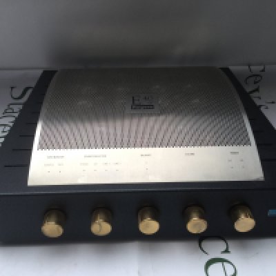 A boxed Rogers E40-A integrated valve amplifier with manuals and cables.