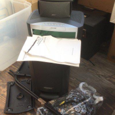 A Bose 3-2-1 home entertainment system with manual and remote control.