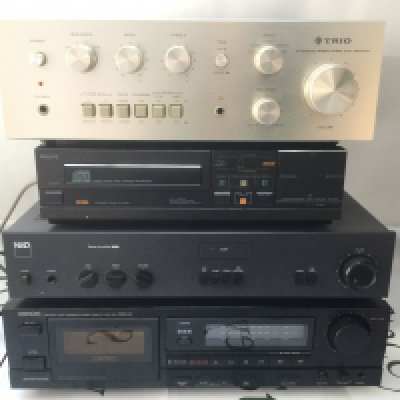 A Trio KA-1600G amplifier, a boxed NAD 3020i amp, boxed Philips CD104 CD player and a boxed Denon DRM-510 cassette deck. Includes some manuals.