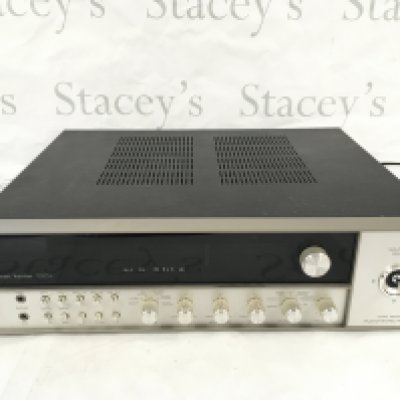 A boxed Harmon Kardon 150+ multichannel receiver. Comes with operating manuals and booklets.