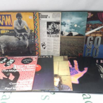 Two bags containing 18 solo Beatles and related LPs comprising Ram, Living In The Material World, Mind Games and others.