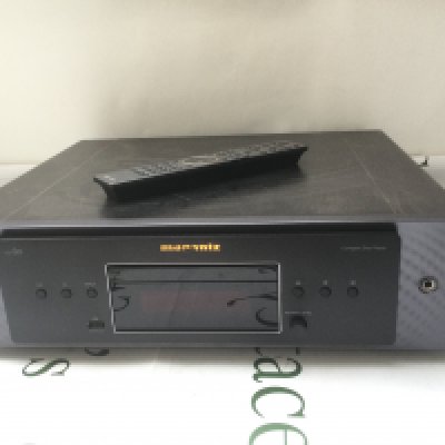 A Marantz CD60 CD player and remote control.