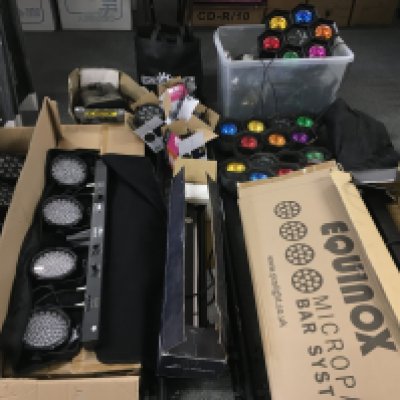 A collection of disco lighting equipment, fog machine, stands etc.