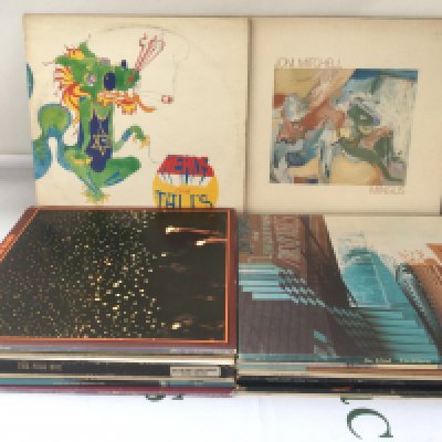 Two bags containing a collection of folk rock LPs by various artists including Bob Dylan, Joni Mitchell, CSNY and others.