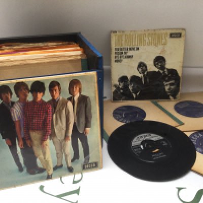A record case of 7" singles and EPs comprising mainly Rolling Stones releases plus The Beatles, The Animals etc.