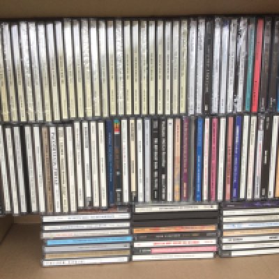 Two boxes of CDs by various artists including The Beatles, Oasis, Adele and many more.