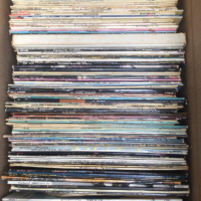 A box of LPs by various artists including Bruce Springsteen, Meatloaf, Ultravox and many more.