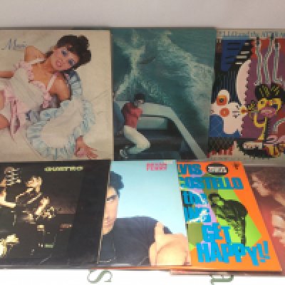 Fourteen rock and pop LPs by various artists including Roxy Music, Elvis Costello and others.
