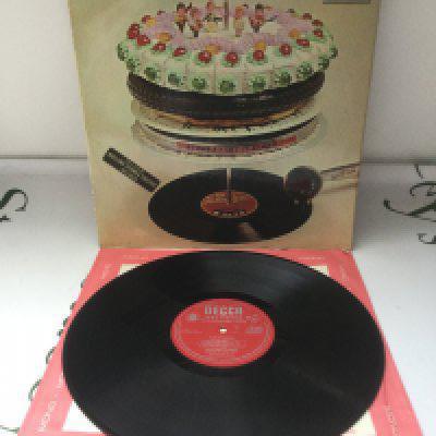 A first UK mono pressing of the Let It Bleed LP by The Rolling Stones complete with inner sleeve and poster. Vinyl Ex.
