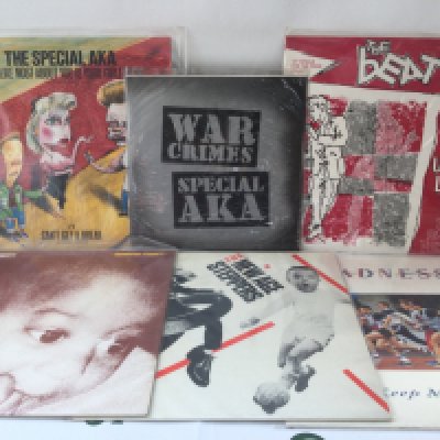 Twelve ska LPs and 12" singles by various artists including Madness, The Beat and others.
