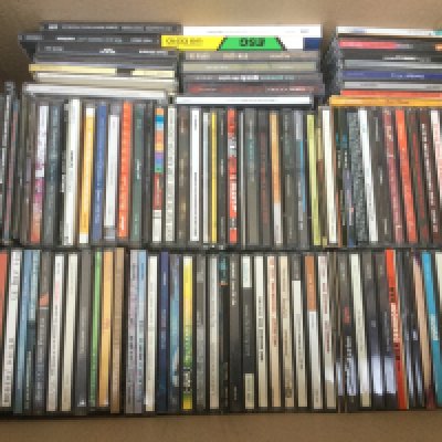 Two boxes of CDs by various artists including Nirvana, The Fall, Grandaddy and many more.