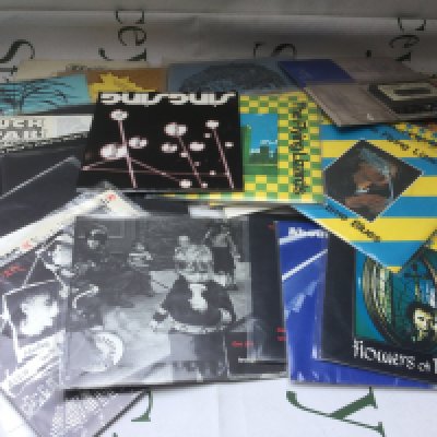 A collection of 7" singles by various artists including PiL, The Residents, The Flying Lizards and others.