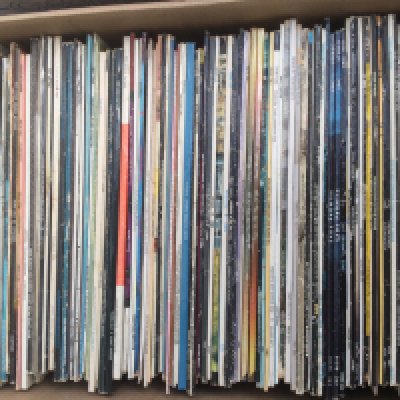 A box and a bag of LPs by various artists including Abba, Elton John, ELO and many more.