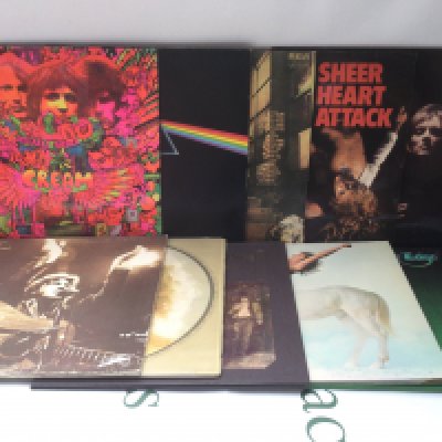 Two bags containing 20 LPs by various artists including David Bowie, Cream, Pink Floyd and others.