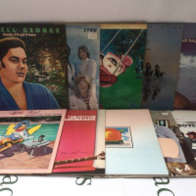 Two bags containing twenty 1970s rock and pop LPs by various artists including Little Feat, Tom Petty, Iggy Pop and others.