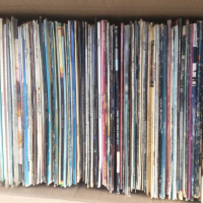 A box of LPs and 12" singles by various artists including Elvis Presley, Lou Reed, INXS and many more.