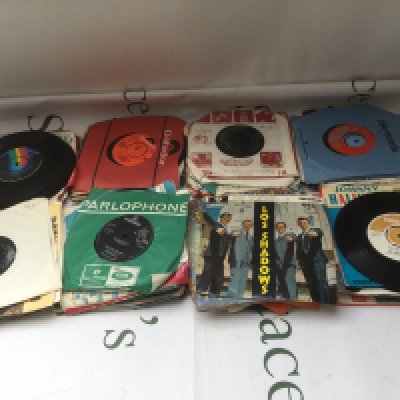 A small collection of 7" singles and EPs including The Beatles, T Rex, Ten Years After and others.