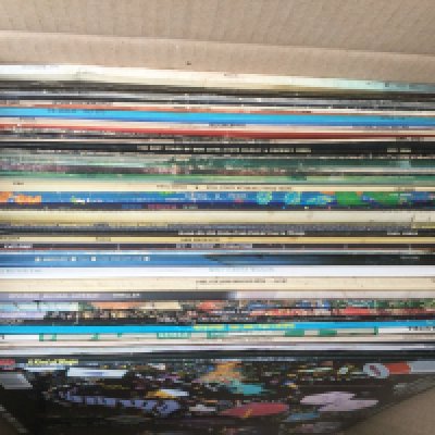A bag and a record case of LPs, EPs and 7" singles by various artists including Pink Floyd, Patti Smith, Queen and others.