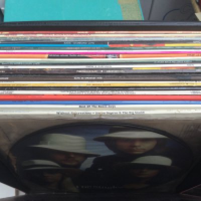 Three record cases of LPs, 12" and 7" singles by various artists including The Beatles, Small Faces, Fleetwood Mac and others.
