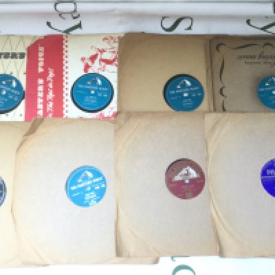 A box of 78s including Elvis Presley, Marty Wilde and others.
