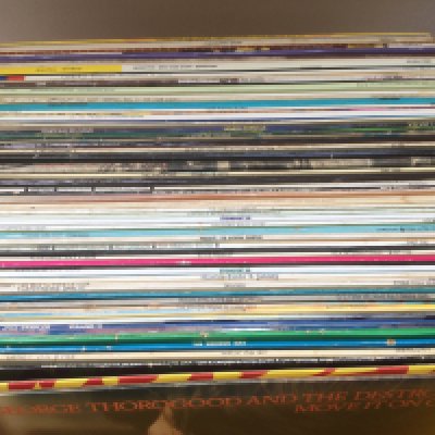 A collection of over 60LPs by various artists including some reggae, rock n roll and pop artists.