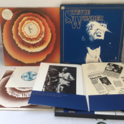 Two bags containing seventeen Stevie Wonder LPs including a Songs In The Key Of Life' press pack, Talking Book, Music Of My Mind and others.