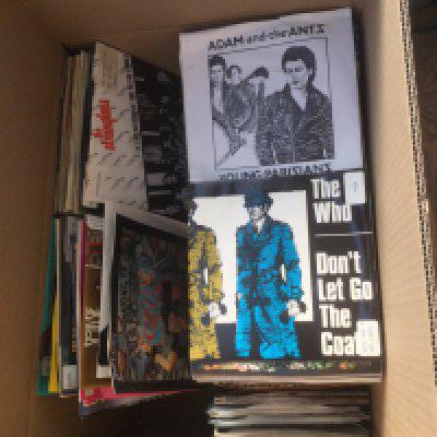 A box of 7" singles by various artists including Iron Maiden, Siouxsie& The Banshees, The Stranglers, The Clash and many more.