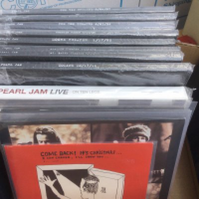 A box of Pearl Jam LPs and 12" singles including self released vinyl box sets of live shows including Moore Theater 1/17/92, Soldier Field 7/11/95 and others.