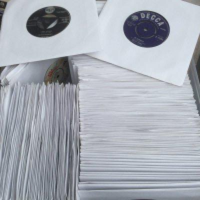 Two boxes of 7" singles by various artists including The Beatles, Elvis Presley, Deep Purple and many more.